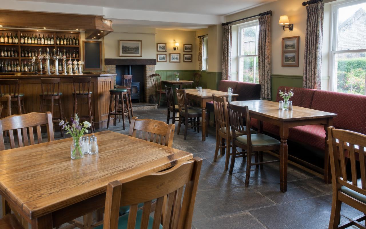Modest English pub dining room with wooden tables and a bar